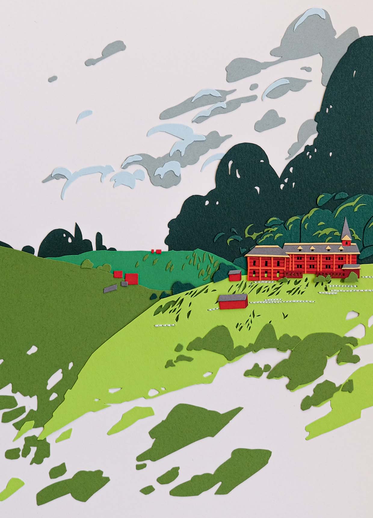 A red schoolhouse with a gray-roofed turret perches on a hill at the edge of a forest. Hills in varying shades of green expand from its walls under a bright white sky.