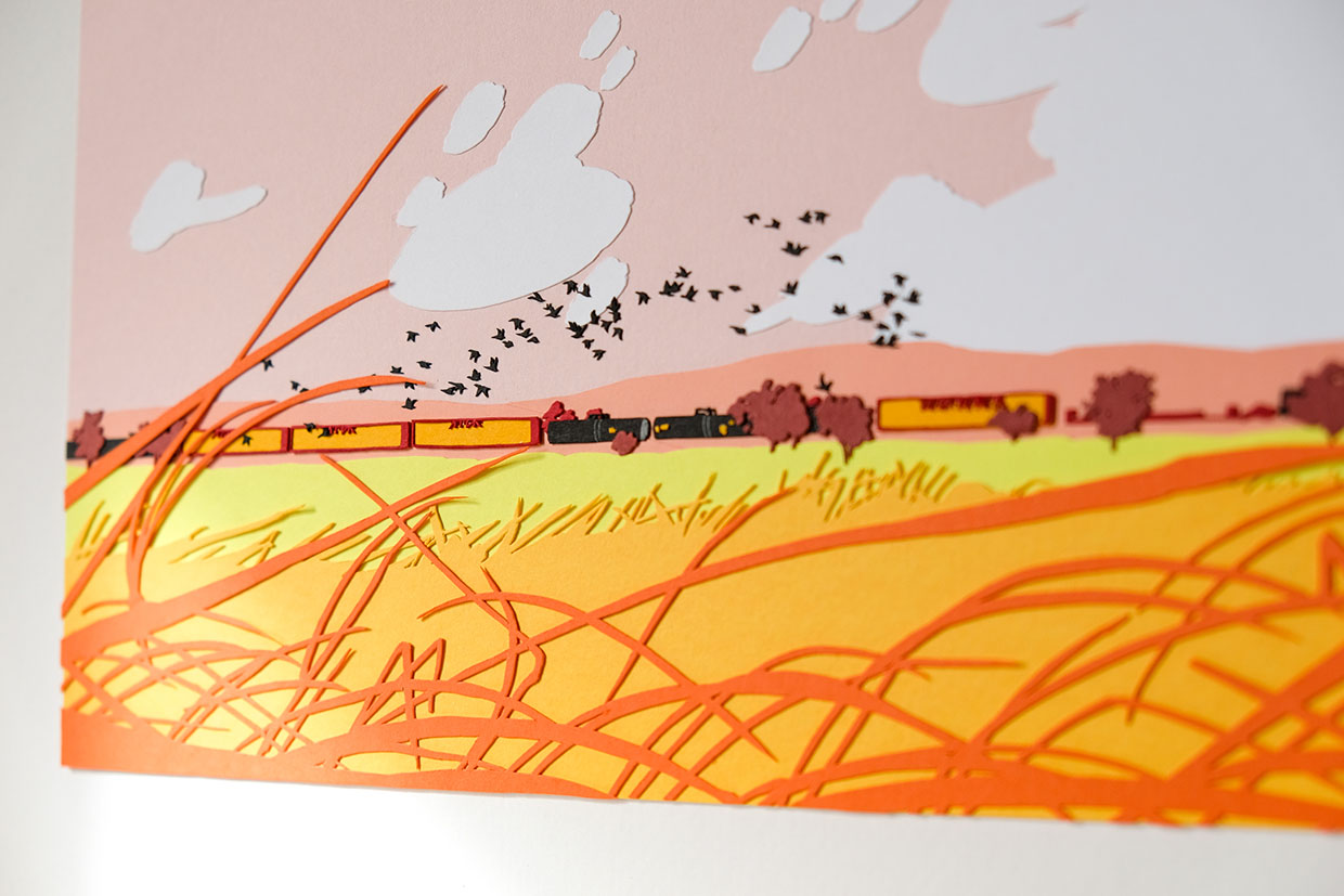 A close up reveals the details in the train cars, with the golden grasses below and the flocks of geese above.