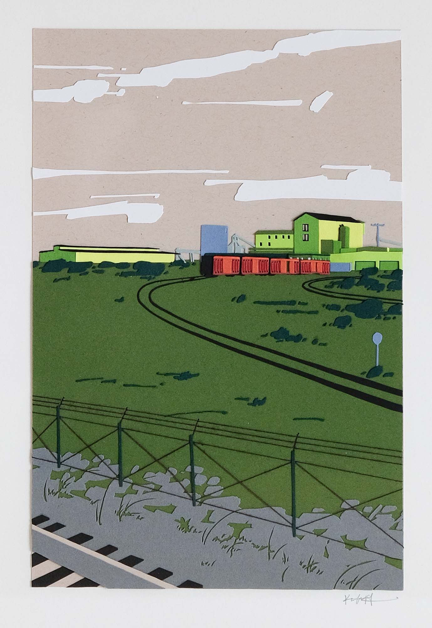 A field of green paper stretches under a dust-colored sky with a green-and-blue hued industrial sprawl on the horizon. A rust-colored train sits on a pair of railroad tracks. A wooden frame surrounds the artwork against a white wall.