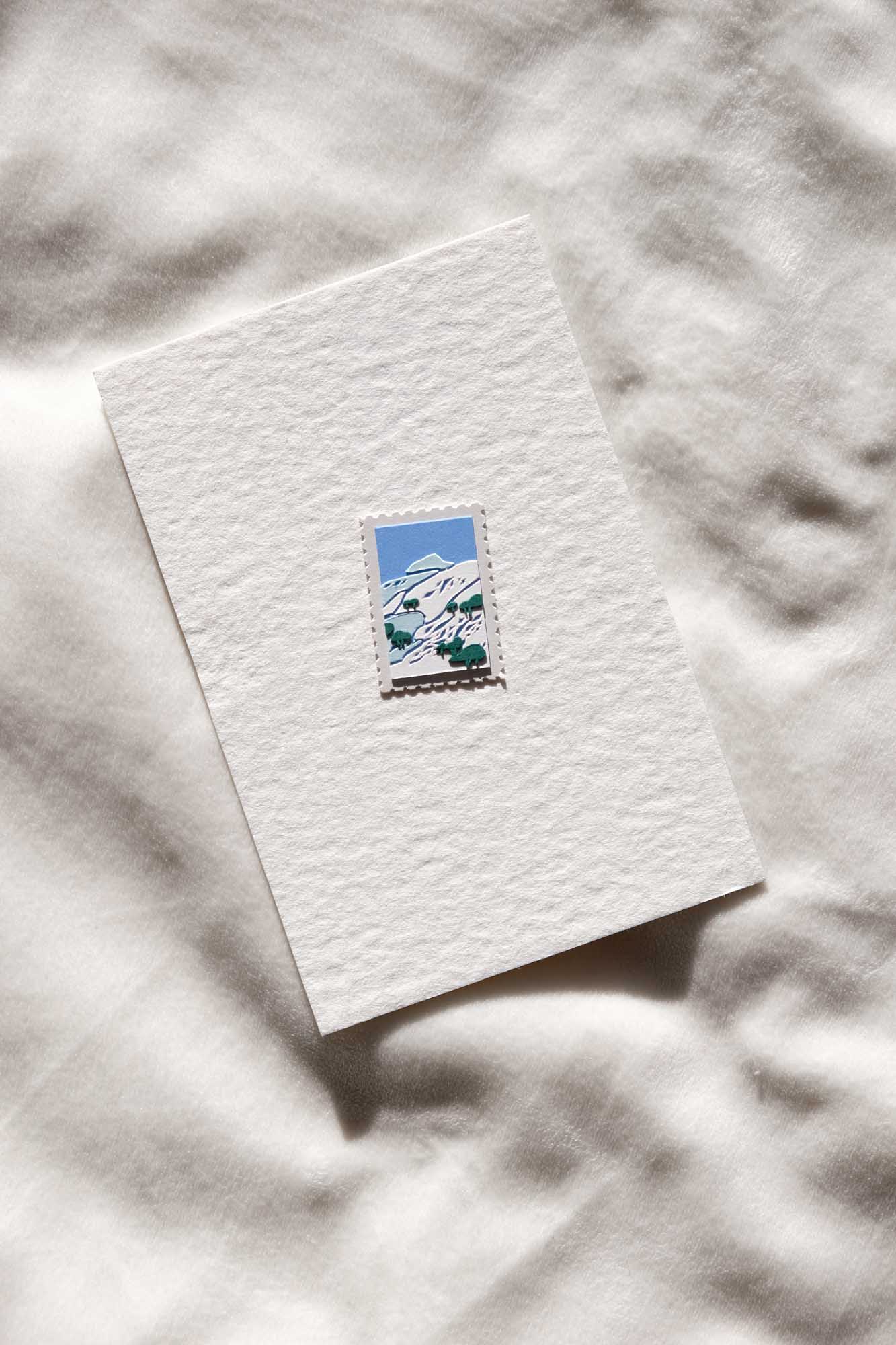 The third stamp imagines a view of the East Bay hills covered in a historical dusting of snow.