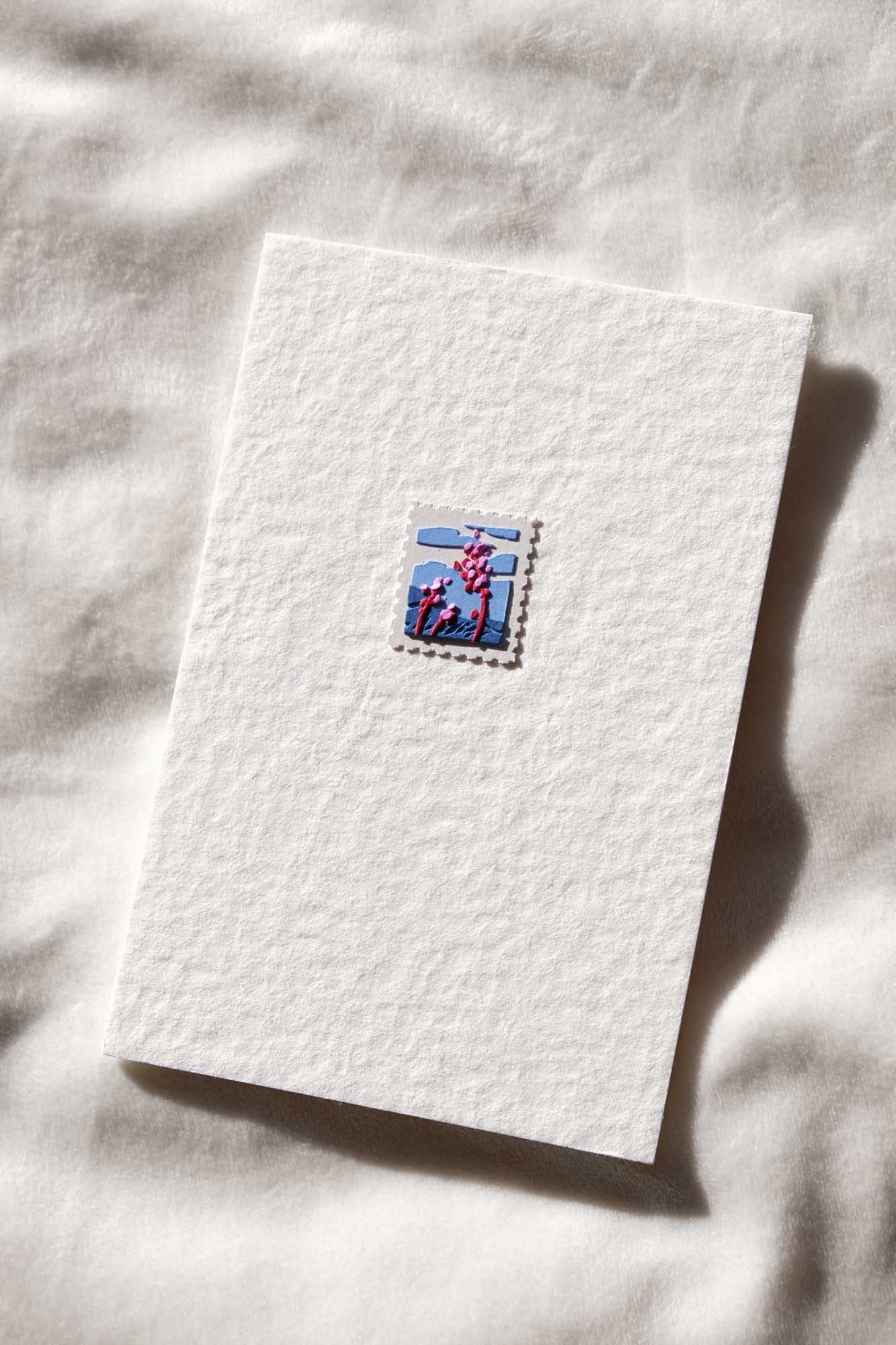 The fourth stamp depicts the stunted flora of the coastal cliffs with fog in the background.