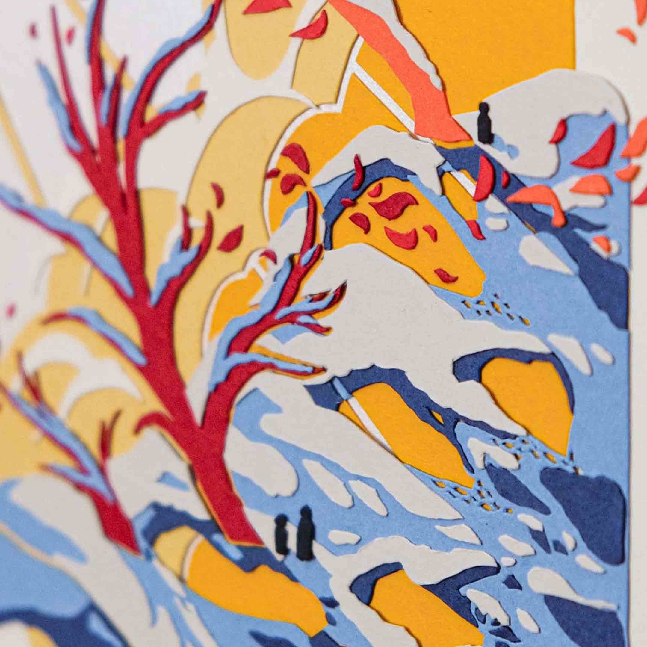A close-up of the artwork shows the tiny silhouettes of people on the winter landscape underneath the trees.